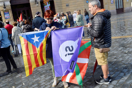 FILE PHOTO: Protesters carry Esteladas, Catalan separatist flags and Basque flags, during a rally in favour of a referendum on independence from Spain for the autonomous community of Catalonia, in the Basque city of Bilbao, Spain September 9, 2017. REUTERS/Vincent West/File Photo