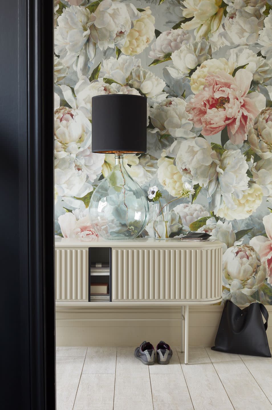 floral wallpaper and sideboard in hallway