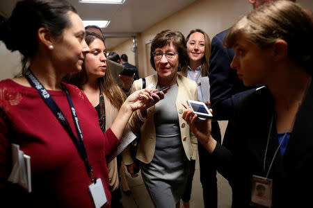 FILE PHOTO - U.S. Senator Susan Collins (R-ME) talks to reporters as she arrives for the weekly Republican party caucus luncheon at the U.S. Capitol in Washington, U.S. October 31, 2017. REUTERS/Jonathan Ernst