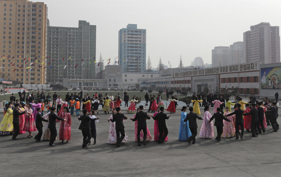 North Koreans dance during the election day at a polling station in Pyongyang, North Korea, Sunday, March 10, 2019. Millions of North Korean voters, including leader Kim Jong Un, are going to the polls to elect roughly 700 members to the national legislature. In typical North Korean style, voters are presented with just one state-sanctioned candidate per district and they cast ballots to show their approval or, very rarely, disapproval. (AP Photo/Dita Alangkara)