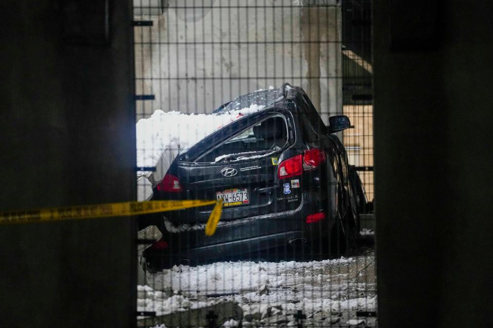 One car impacted by the partial collapse of the Bayshore Mall parking structure Thursday, Feb. 23, 2023, in Glendale, Wis.