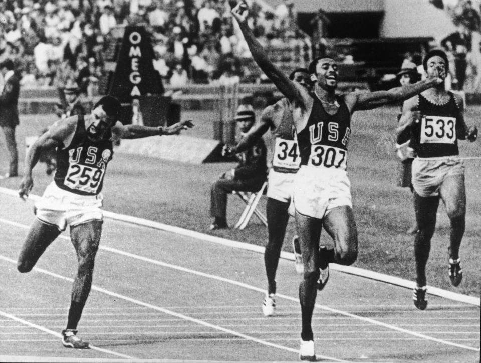 Tommie Smith wins gold in the 200 meters at the 1968 Olympics in a world record time of 19.83 seconds.