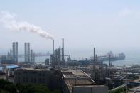 FILE PHOTO: China National Petroleum Corporation (CNPC)'s Dalian Petrochemical Corp refinery is seen near the downtown of Dalian