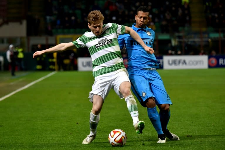 Celtic's midfielder Stuart Armstrong (L) fights for the ball against Inter Milan's midfielder Fredy Guarin during the UEFA Europa League football match February 26, 2015