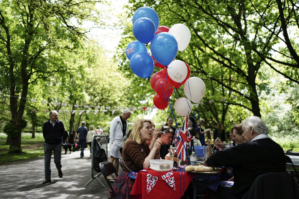 People take part in a Coronation Big Lunch in Regent's Park, London, Sunday May 7, 2023. Thousands of people across the country are celebrating the Coronation Big Lunch to mark the crowning of King Charles III and Queen Camilla. (Jordan Pettitt/PA via AP)