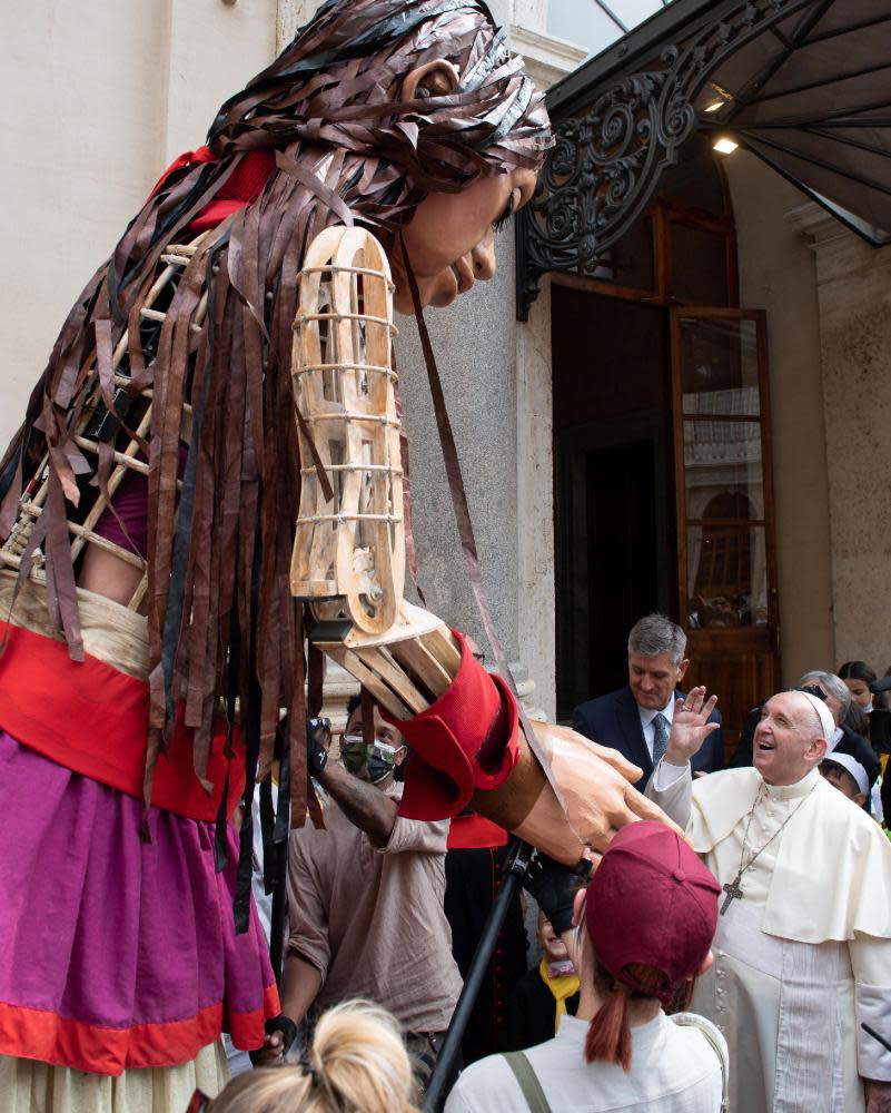 Pope Francis greets Little Amal at the Vatican.