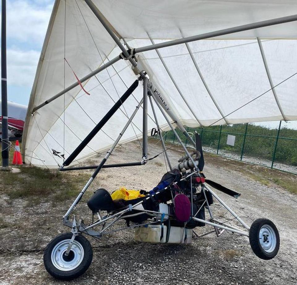 Two Cuban migrants landed at Key West International Airport on a motorized hang glider at approximately 10:30 a.m. Saturday, March 25, 2023, according to Monroe County Sheriff’s Office. Officials at the airport gather on the runway near the ultralight aircraft, pictured here.