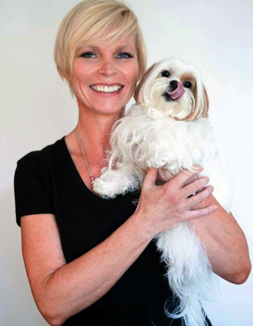 This undated image provided by Candice Ball shows Ball holding her dog, Toshi. Ball, of New York City, was tired of wasting money on training classes that didn't work for her or her 6-year-old shih tzu Toshi. "I failed the classes. He wasn't treat-motivated. We sat and stared at each other. Then someone recommended Babette Haggerty's and her praise-only training methods." she said. A well-trained Toshi has since appeared on "Law and Order: SVU," the final episode of "30 Rock" and in a New York Yankees commercial for MasterCard. (AP Photo/Candice Ball)