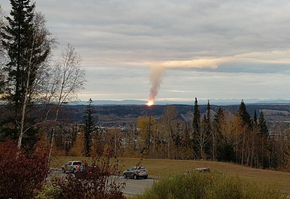 This Tuesday, Oct. 9, 2018, photo provided by Dhruv Desai shows an explosion near the community of Shelley, British Columbia. The massive pipeline explosion risks cutting off the flow of Canadian natural gas to Washington State, and companies are urging customers to conserve. (Dhruv Desai via AP)