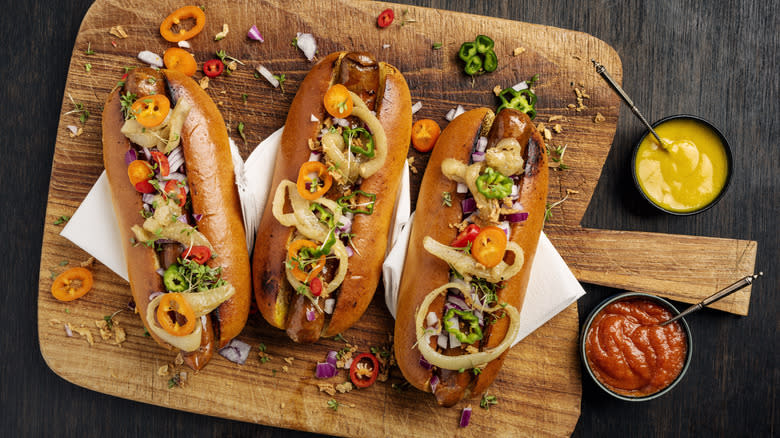 Overhead view of three hot dogs