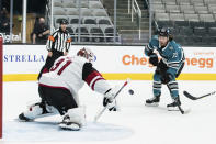 Arizona Coyotes goaltender Adin Hill (31) blocks a shot by San Jose Sharks center Noah Gregor (73) during the first period of an NHL hockey game in San Jose, Calif., Saturday, May 8, 2021. (AP Photo/John Hefti)