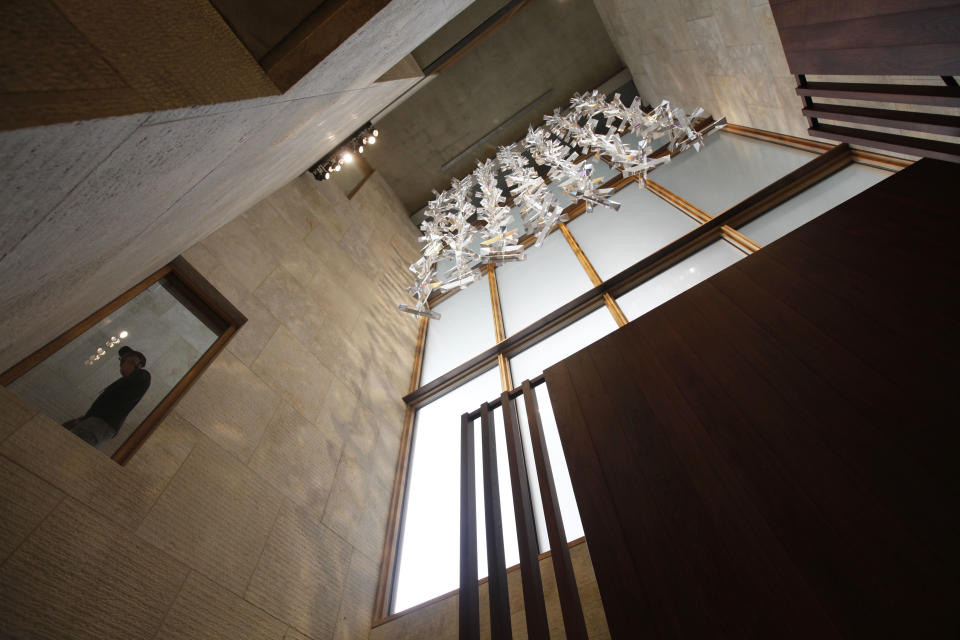 A visitor walks past a window in a stairwell during a preview at The Barnes Foundation Wednesday, May 16, 2012, in Philadelphia. After years of bitter court fights, the Barnes Foundation is scheduled to open its doors to the public on May 19 at its new location on Philadelphia's "museum mile." (AP Photo/Matt Rourke)