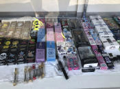 FILE - This Aug. 28 2019, file photo shows boxes of vaping products labeled with the Dank name, seen left, for sale at a retail vaping store downtown Los Angeles. A shadowy but widely sold illegal marijuana vape is drawing the attention of investigators looking into a rash of mysterious lung illnesses around the country. Investigators have not identified a culprit in the outbreak but say patients have frequently mentioned using Dank Vapes. (AP Photo/Michael R. Blood, File)