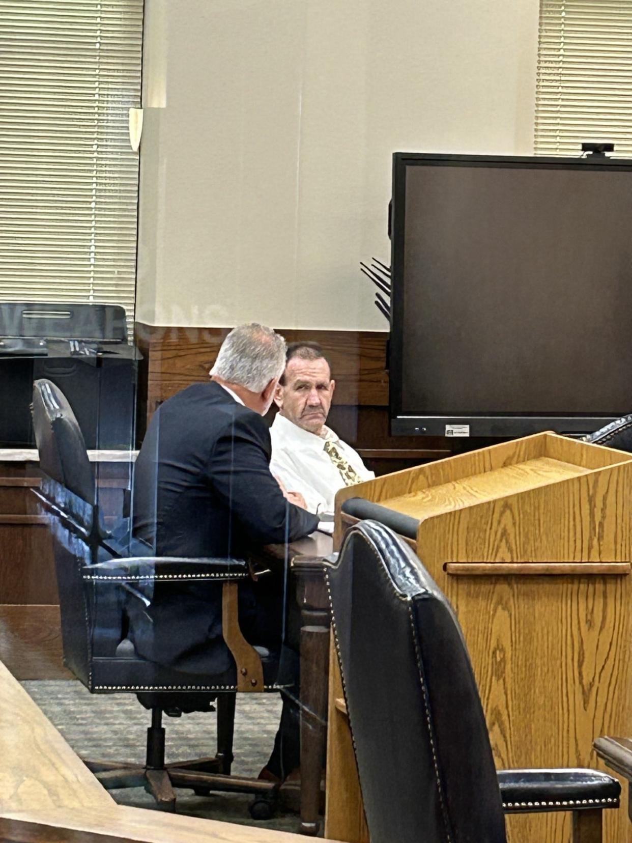 Larry Doil Sanders, right, talks to his defense attorney, Larry Balcerak, in the courtroom at the Pontotoc County Courthouse as they wait for the verdict in his murder trial Wednesday.