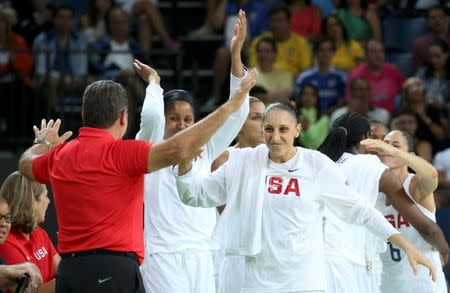 2016 Rio Olympics - Basketball - Final - Women's Gold Medal Game USA v Spain - Carioca Arena 1 - Rio de Janeiro, Brazil - 20/8/2016. Head coach Geno Auriemma (USA) of USA greets Diana Taurasi (USA) of USA after the team's gold medal victory over Spain. REUTERS/Shannon Stapleton