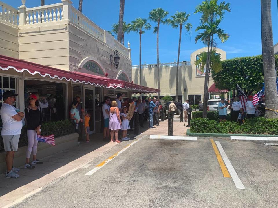 Supporters of former President Donald Trump gather outside Versailles restaurant on Southwest Eighth Street in Miami on Tuesday, June 13, 2023, hoping Trump would stop by after being arraigned in Miami federal court on Tuesday afternoon.