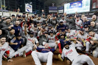 The Boston Red Sox pose for a picture after winning the baseball American League Championship Series against the Houston Astros on Thursday, Oct. 18, 2018, in Houston. Red Sox won 4-1. (AP Photo/David J. Phillip)