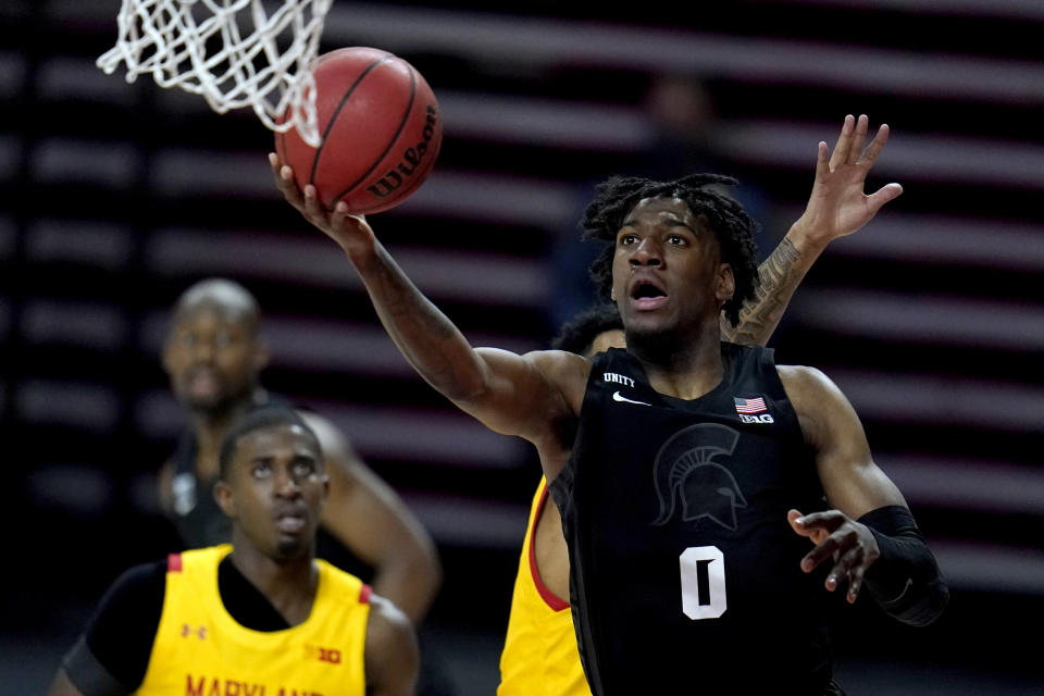 Michigan State forward Aaron Henry (0) goes up for a shot against Maryland during the first half of an NCAA college basketball game, Sunday, Feb. 28, 2021, in College Park, Md. (AP Photo/Julio Cortez)