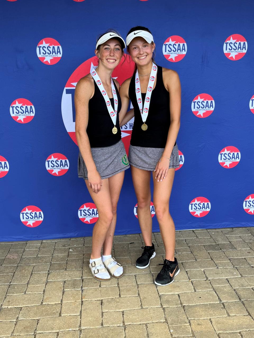 Freshman Lillie Murphy, left, and sophomore Eleni Liakonis are pictured after beating a Chattanooga Baylor team for the state doubles title in their division on May 27, 2022.