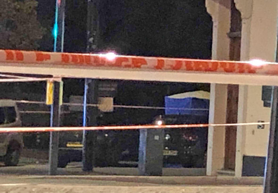 A police tent in Sydenham Road, south-east London, after a man in his twenties was found with gunshot wounds and died at the scene on Sunday afternoon.