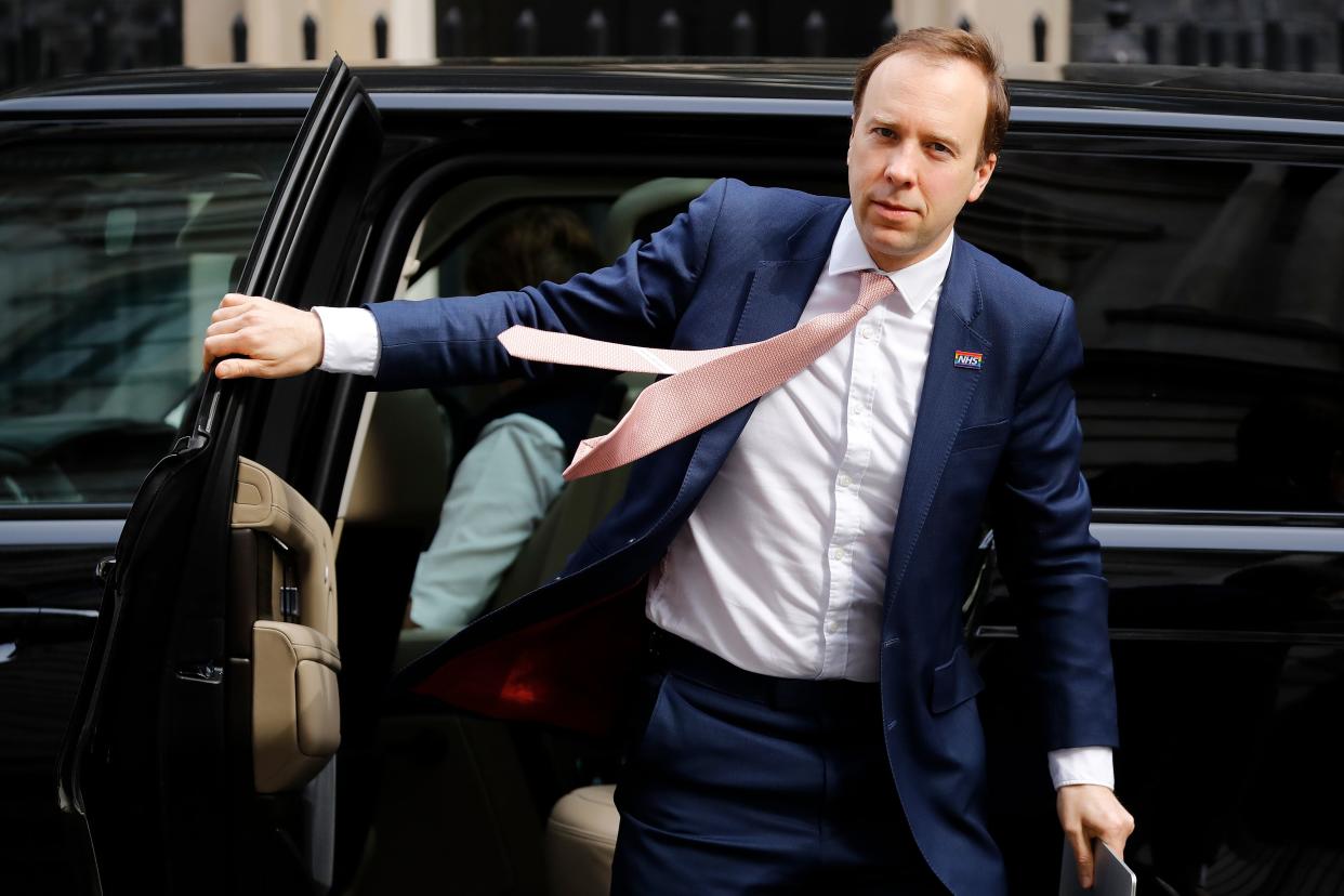 Britain's Health Secretary Matt Hancock arrives in Downing Street in central London on May 5, 2020 for the daily novel coronavirus COVID-19 briefing. - Britain was poised on Monday to roll out a new smartphone tracing app for coronavirus on an island off England's south coast, as the country looks to ease a six-week nationwide lockdown. The app, developed by the state-run National Health Service (NHS), will be trialled on the Isle of Wight ahead of its planned rollout across Britain later this month. (Photo by Tolga AKMEN / AFP) (Photo by TOLGA AKMEN/AFP via Getty Images)