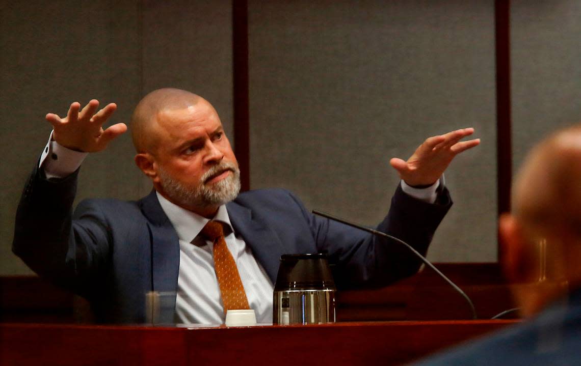 Judge Sam Swanberg gestures with his hands to help describe the layout of his house while answering questions by his defense attorney Scott Johnson while giving testimony in a Franklin County courtroom during his trial in 2022.