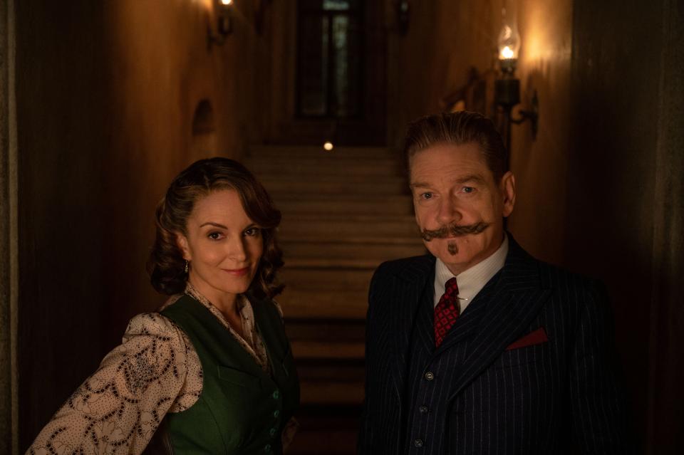 Tina Fey plays Ariadne Oliver and Kenneth Branagh is Hercule Poirot in 20th Century Studios' "A Haunting in Venice."