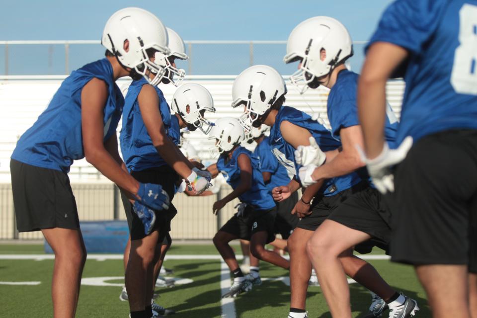 Reagan County High School football players participate in a blocking drill during workout Monday, Aug. 1, 2022, at James H. Bird Memorial Stadium in Big Lake.