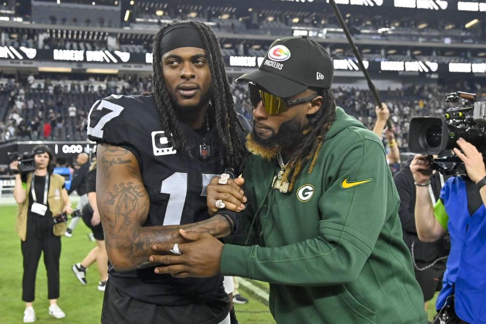 Las Vegas Raiders' Davante Adams talks to Green Bay Packers' Aaron Jones after an NFL football game Monday, Oct. 9, 2023, in Las Vegas. The Raiders won 17-13. (AP Photo/David Becker)