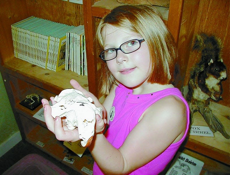 Jessica Nemeth, 7, holds a beaver skull at the Oak Island Nature Center. Along with the Ocean Education Center, the Nature Center is run by Oak Island Parks and Recreation Department.