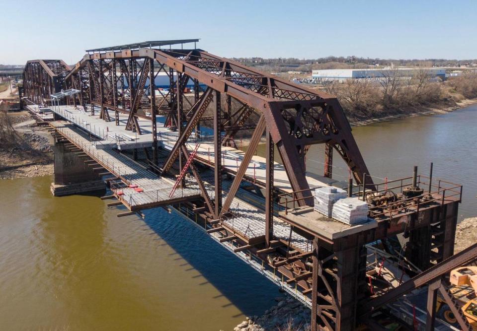 Platforms have been added to the Rock Island Bridge, which is being turned into an entertainment district 60 feet above the Kansas River, just west of the HyVee Arena in Kansas City. The bridge will also be used for a public crossing into Kansas City, Kansas, feature shops, music and entertainment, as well as a community center, a trailhead. Flying Truss, LLC, is the developer and the website for the project says it should open in Summer of 2024.