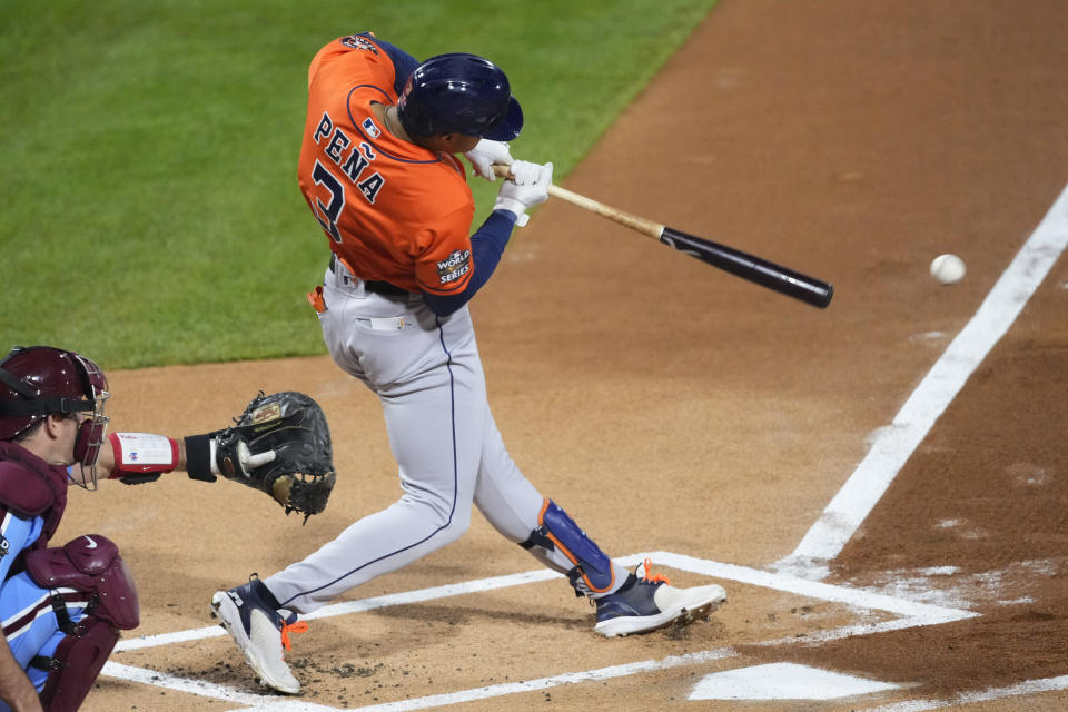 Houston Astros' Jeremy Pena hits an hits an RBI single during the first inning in Game 5 of baseball's World Series between the Houston Astros and the Philadelphia Phillies on Thursday, Nov. 3, 2022, in Philadelphia. (AP Photo/Chris Szagola)