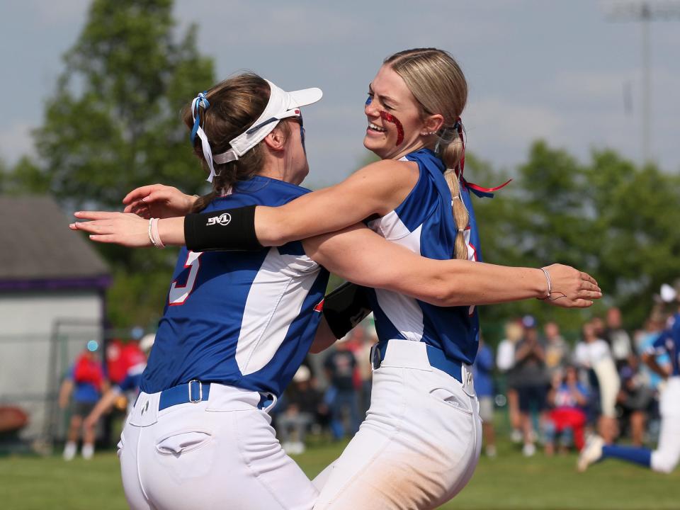 Highland’s Abby Jordan, left, and Aubree Bellamy celebrate the Scots’ 5-3 victory against Jonathan Alder during a Division II district final at Pickerington Central on Saturday, May 20, 2023.