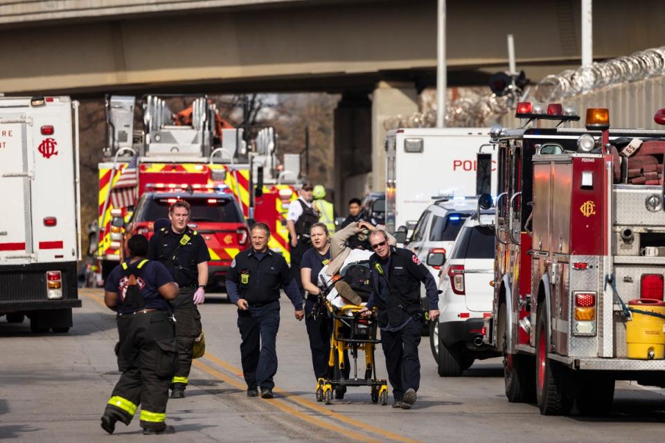 A person is taken away via ambulance after a Chicago Transit Authority train crashed into a piece of snow-removal equipment. (AP)