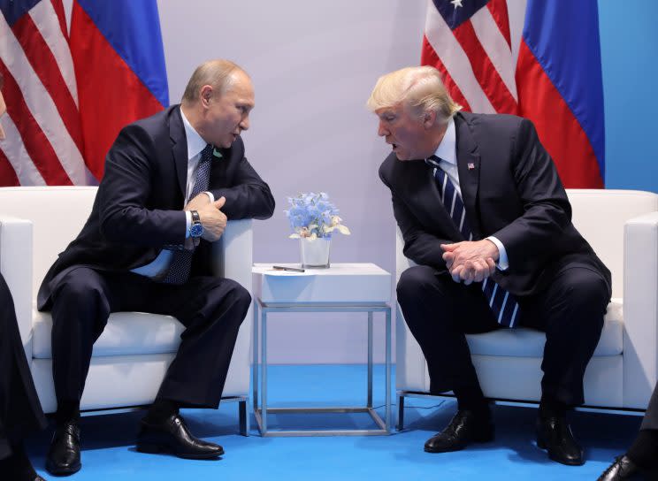 Russian President Vladimir Putin and President Trump talk at the G-20 summit in Hamburg, Germany, on Friday. (Carlos Barria/Reuters)