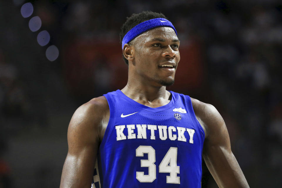 FILE - Kentucky forward Oscar Tshiebwe (34) smiles against Florida during the second half of an NCAA college basketball game on March 5, 2022, in Gainesville, Fla. Kentucky begins with college basketball’s best player and a preseason No. 4 ranking, though it’s unknown when injured Tshiebwe will be available to help the Wildcats live to up to their lofty billing. (AP Photo/Matt Stamey, File)