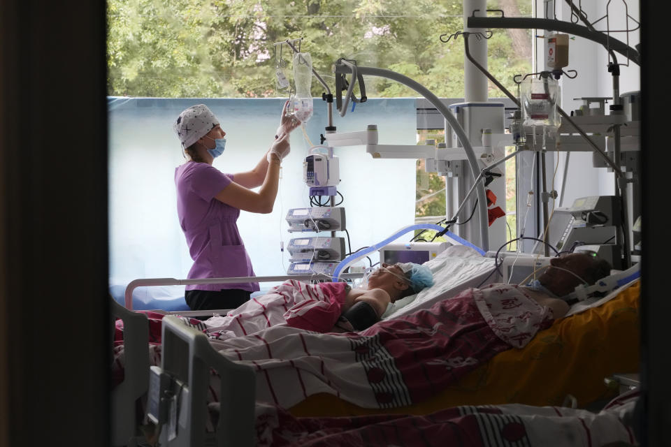 A medical worker takes care of people injured during Russian shelling on Thursday in a hospital in Vinnytsia, Ukraine, Friday, July 15, 2022. Russian missiles struck the city of Vinnytsia in central Ukraine on Thursday, killing at least 23 people and injuring more than 100 others, Ukrainian officials said. (AP Photo/Efrem Lukatsky)