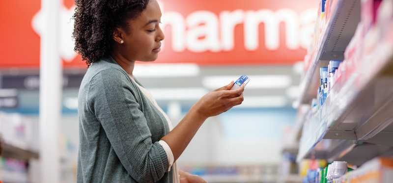 Female shopper in a store aisle.