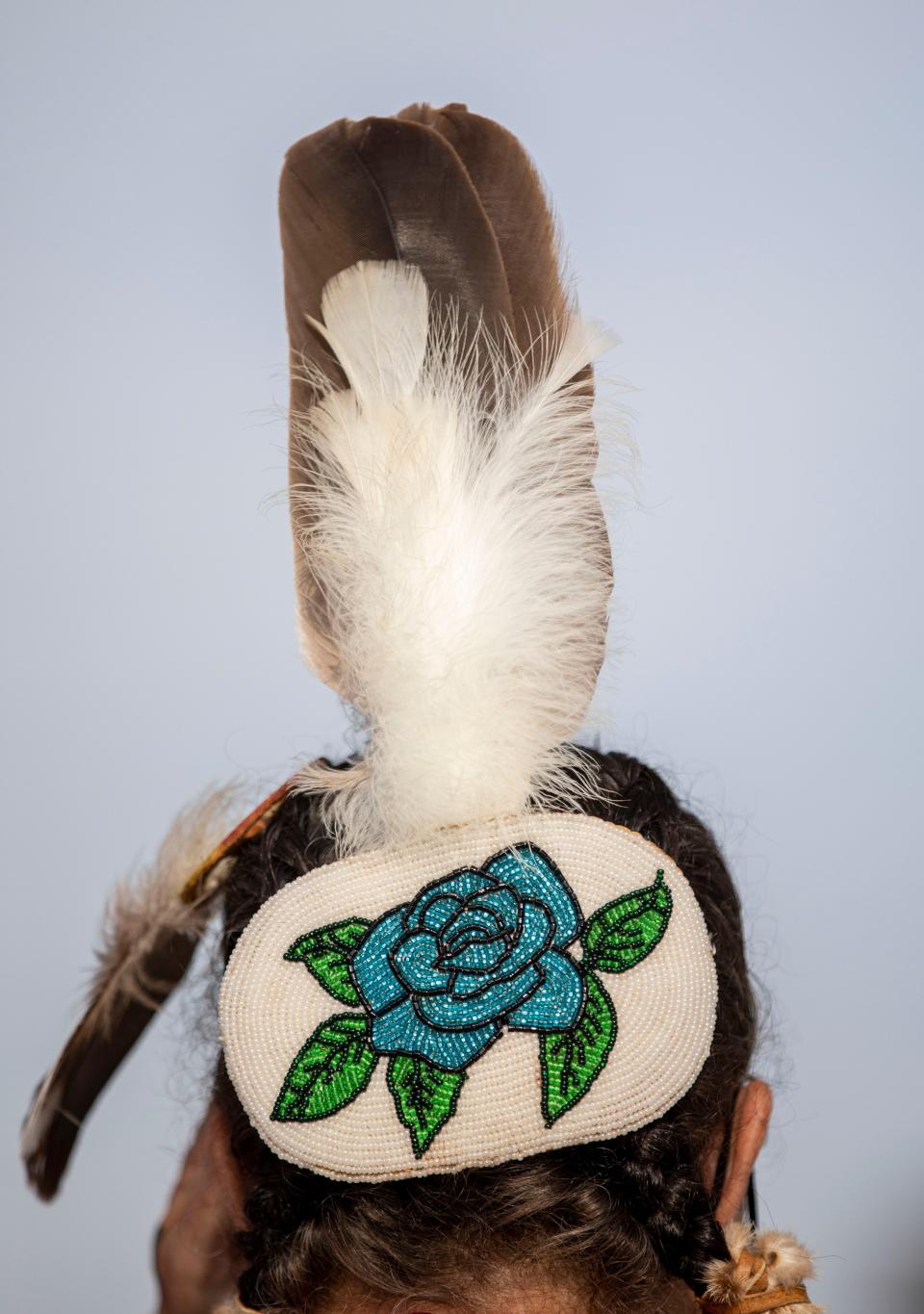 An eagle feather is worn by a traditional dancer during Indigenous Peoples' Day on Monday, Oct. 10, 2022 at Riverfront Park in Salem, Ore.