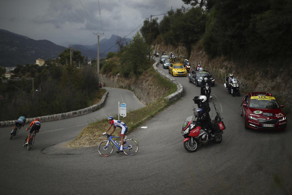 France's Fabien Grellier, center, rides during the first stage of the Tour de France cycling race over 156 kilometers (97 miles) with start and finish in Nice, southern France, Saturday, Aug. 29, 2020. (AP Photo/Daniel Cole)