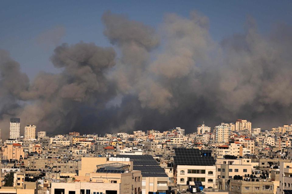 Smoke billows during Israeli air strikes in Gaza City (AFP via Getty Images)