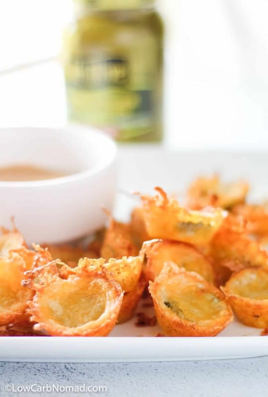 <p>Low Carb Nomad</p><p>Satisfy your chips craving while staying committed to your Keto lifestyle. Crispy on the outside and tender pickles on the inside.</p><p><strong>Get the recipe: <a href="https://www.lowcarbnomad.com/keto-pickle-chips" rel="nofollow noopener" target="_blank" data-ylk="slk:Keto Pickle Chips;elm:context_link;itc:0;sec:content-canvas" class="link ">Keto Pickle Chips</a></strong></p>