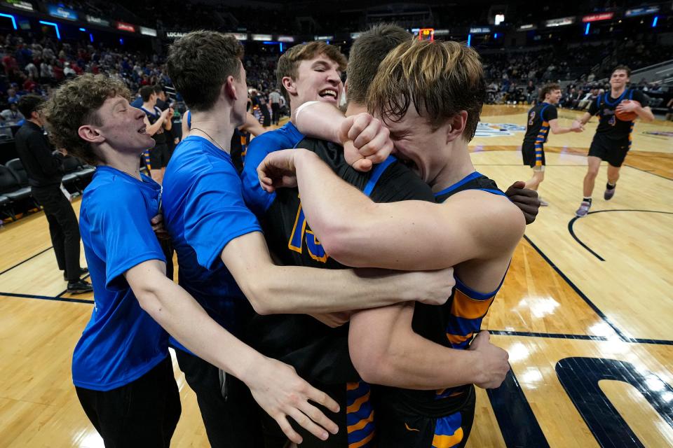 The Fort Wayne Blackhawk Christian Braves celebrate at the buzzer as they defeat Linton-Stockton, 52-45, for the IHSAA Class 2A state title Saturday, March 25, 2023, at Gainbridge Fieldhouse in Indianapolis.