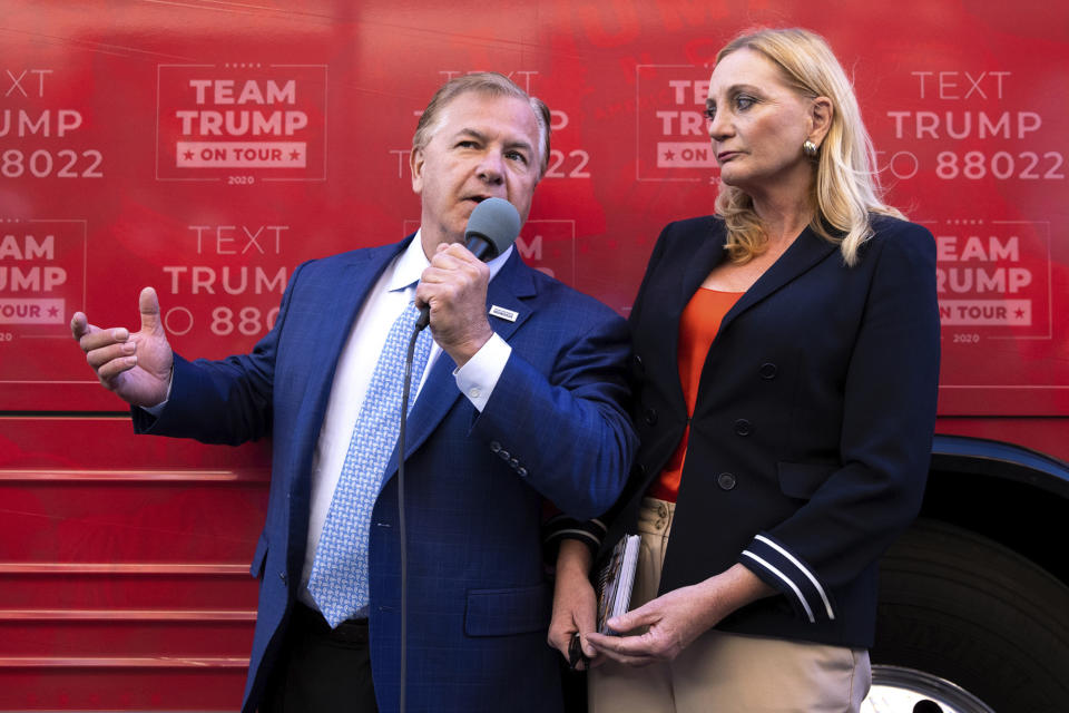 St. Louis-based lawyers Mark and Patricia McCloskey speak outside the Republican campaign office in downtown Scranton, Pa., during an appearance with former congressman Lou Barletta for a Trump campaign event on Wednesday, Sept. 30, 2020. The McCloskeys received national attention in June when they pulled guns on Black Lives Matter protesters who broke into their gated community and marched past their home. (Christopher Dolan/The Times-Tribune via AP)