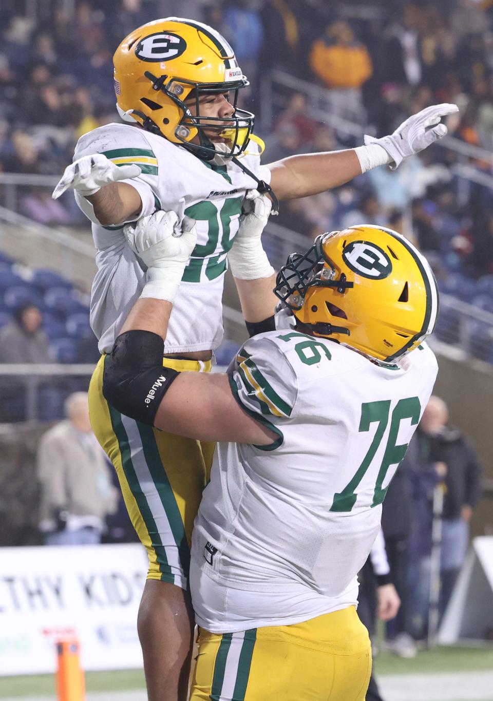 St. Edward running back Brandon White is lifted up by offensive lineman Ben Roebuck after a first half touchdown in this Division I state final game Friday, Dec. 1, 2023, in Canton.