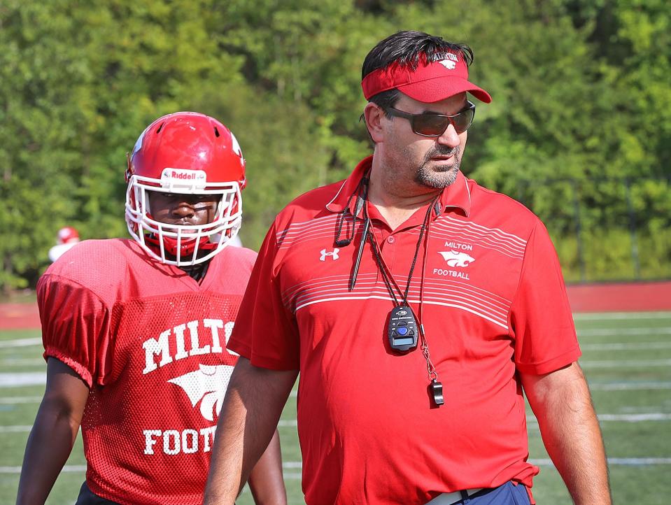 Coach Steve Dembowski works with his prospects. The Milton High Wildcats football team practices for the new season on Wednesday August 24, 2022.