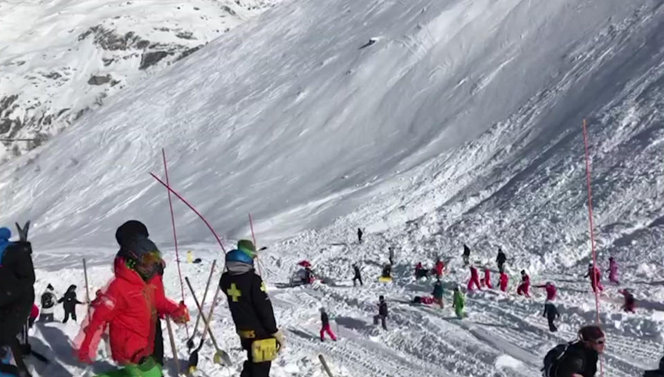 In this image taken from video, rescue personnel work at the site of an avalanche at Lavachet Wall in Tignes, France Monday Feb. 13, 2017. French rescue workers say a number of skiers have been killed in an avalanche in the French Alps near the resort of Tignes with others being pulled out of the snow with shovels. (AP Photo)