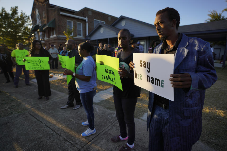 FILE - In this Sunday, Oct. 13, 2019 file photo, protesters gather outside the house, rear right, where Atatiana Jefferson was shot and killed by police in Fort Worth, Texas. A white Fort Worth police officer Aaron Dean shot and killed Jefferson, a black woman, through a back window of her home. Dean resigned before being charged with murder Monday. He was taken into custody two days after the killing. (Smiley N. Pool/The Dallas Morning News via AP, File)