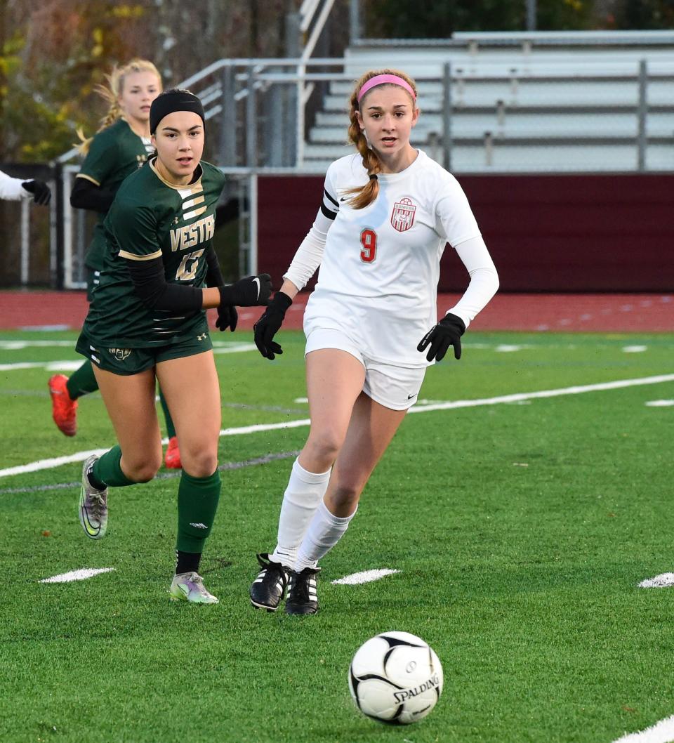 Vestal's Ava Schmidt (13) and Somers' Annie Maguire go after the ball during Somers' 2-1 victory in a Class AA girls soccer subregional Nov. 1, 2023 at Johnson City High School.