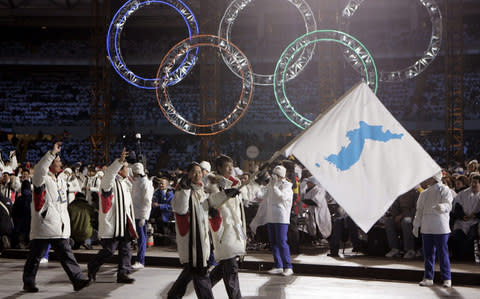 Athletes from North and South marched together with a unification flag at the 2006 Winter Olympics in Turin - Credit: AP